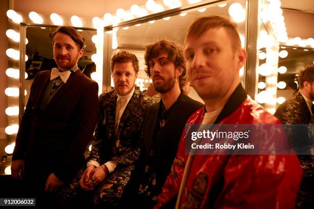 Recording artists Daniel Platzman, Dan Reynolds, Wayne Sermon and Ben McKee of musical group Imagine Dragons pose for a photo during MusiCares Person...