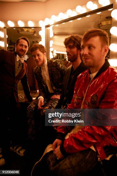 Recording artists Daniel Platzman, Dan Reynolds, Wayne Sermon and Ben McKee of musical group Imagine Dragons pose for a photo during MusiCares Person...