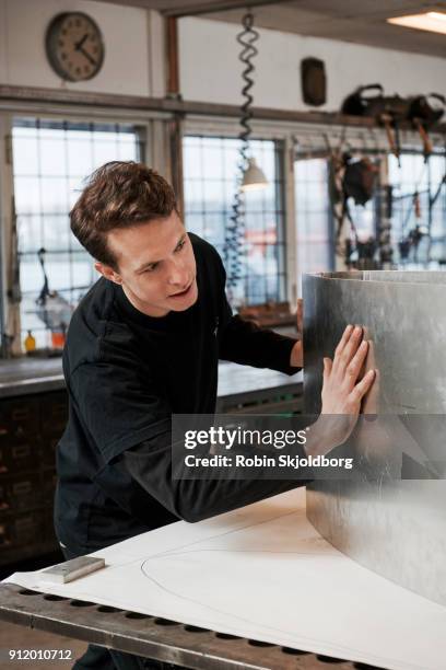 blacksmith at work in workshop - robin skjoldborg stock pictures, royalty-free photos & images