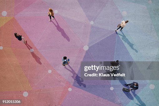 Top view of people walking in different directions of pattern, painted on asphalt Top view of people walking in different directions of pattern, painted on asphalt