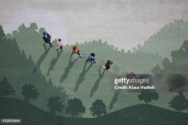businesspeople walking down hill side, painted on asphalt - eco ideas stockfoto's en -beelden