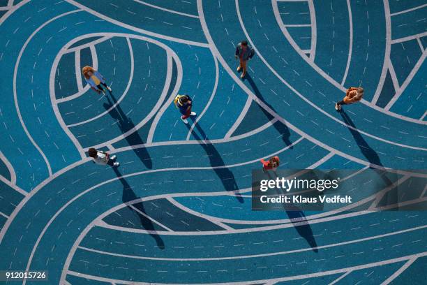 group of people standing on different curvy roads, painted on asphalt - alternativ bildbanksfoton och bilder