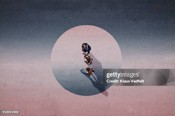 young businesspeople hugging. standing in painted circle on asphalt - harmony photos et images de collection