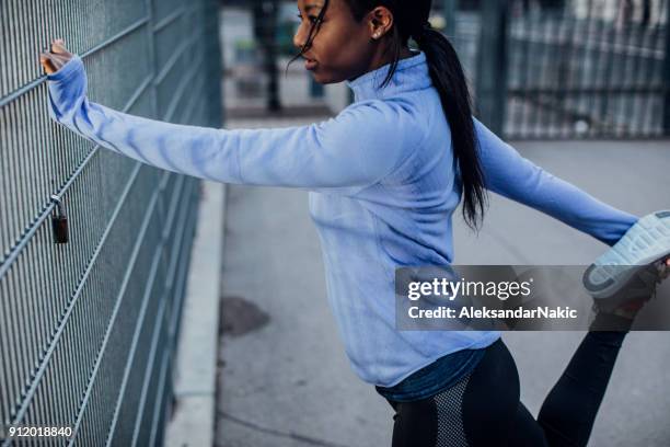 warming up for a workout - hamstring stock pictures, royalty-free photos & images