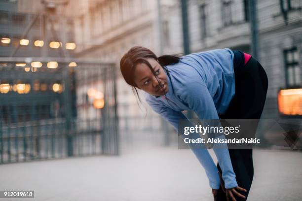 stretching out after workout - hamstring stock pictures, royalty-free photos & images