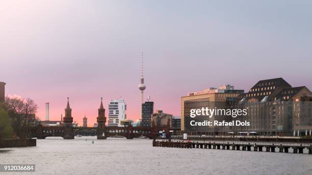 sunset at east harbour, berlin, germany - fernsehturm berlijn stock pictures, royalty-free photos & images