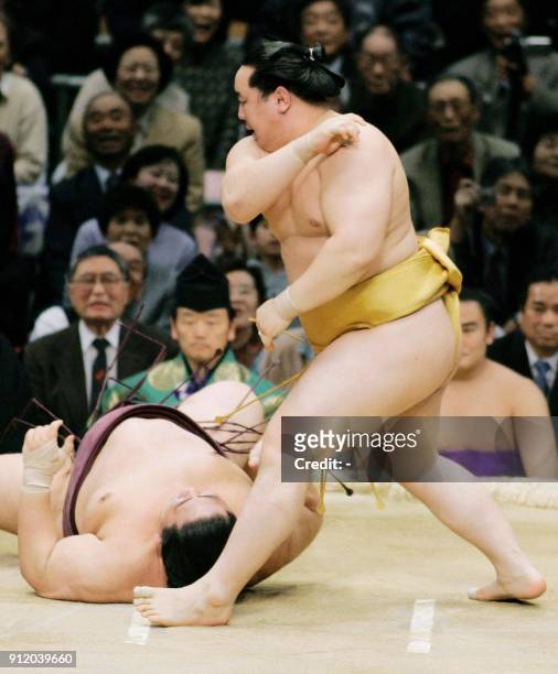 Sumo "yokozuna", or grand champion Asashoryu throws sekiwake-ranked Miyabiyama on the ground to defeat on day 12 of the 15-day Spring Grand Sumo...