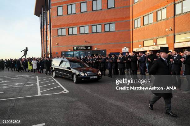 Fans, Staff and Players of West Bromwich Albion applaud as the Hearse arrives during the Cyrille Regis Memorial Service at The Hawthorns on January...