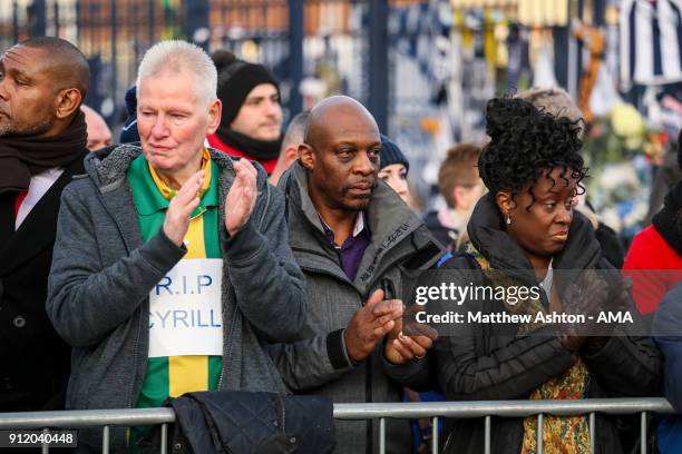 Fans of West Bromwich Albion applaud as the Hearse passes The Hawthorns, home stadium of West Bromwich Albion during the Cyrille Regis Memorial...