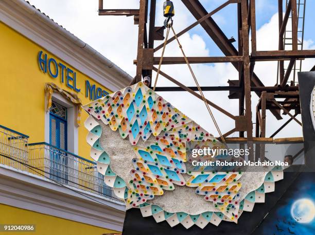 The construction of the 'San Salvador' district display of lights . A crane lifts a part of the assembled construction. The Mascotte Hotel can be...
