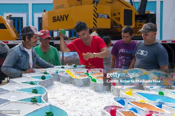 Followers of the 'San Salvador' district work on a part of the 'Trabajo de Plaza' for the famous 'parrandas' or Christmas festival.