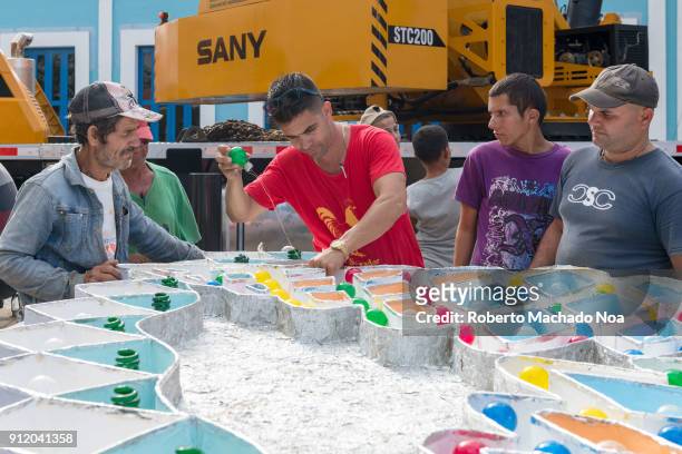 Followers of the 'San Salvador' district work on a part of the 'Trabajo de Plaza' for the famous 'parrandas' or Christmas festival.