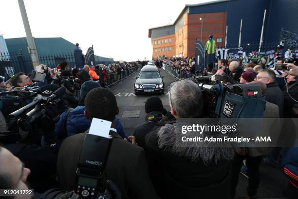 And print Media gather around the hearse as it departs the stadium Funeral Service of former West Bromwich Albion player Cyrille Regis at he...