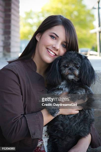 pretty girl with cute dog - lhasa apso puppy stock pictures, royalty-free photos & images