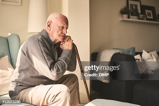 Elderly man sitting alone at home Elderly man sitting alone at home