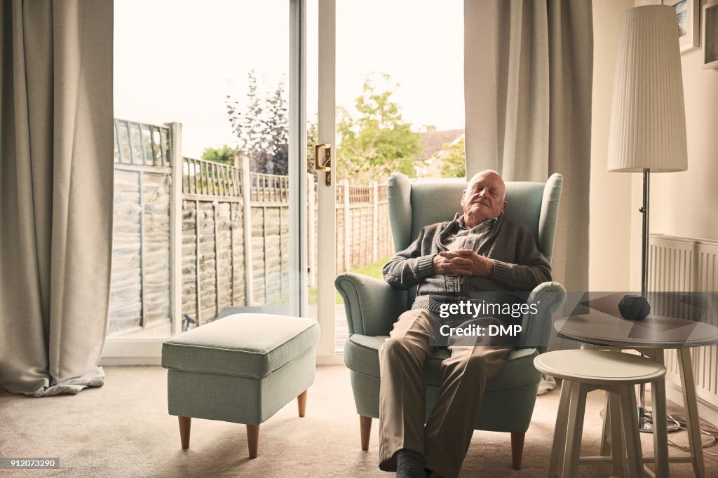 Senior man sleeping on a armchair