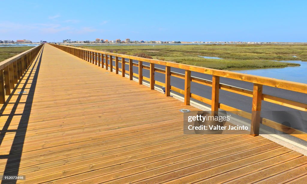 Footbridge and bicycle path in the access to Praia de Faro, Portugal