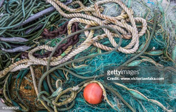 fishing nets and and ropes at the port of travemünde, germany - travemuende stock pictures, royalty-free photos & images