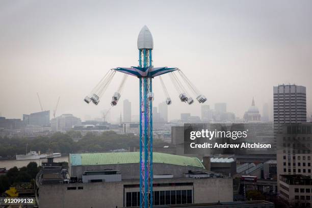 Tourists enjoying a carousel fairground ride called a Starflyer in Jubilee park on the South bank next to the Royal Festival Hall, London, United...