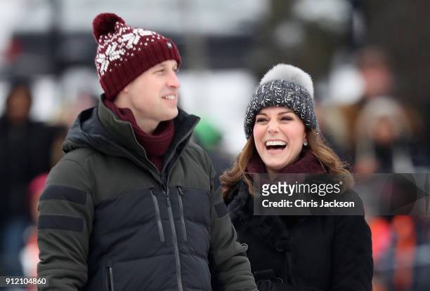 Prince William, Duke of Cambridge and Catherine, Duchess of Cambridge laugh as they attend a Bandy hockey match where they will learn more about the...