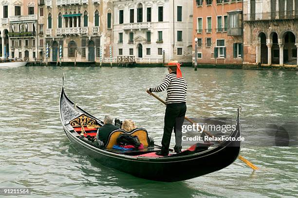 gondola on grand canal in venice, italy - italian boats stock pictures, royalty-free photos & images