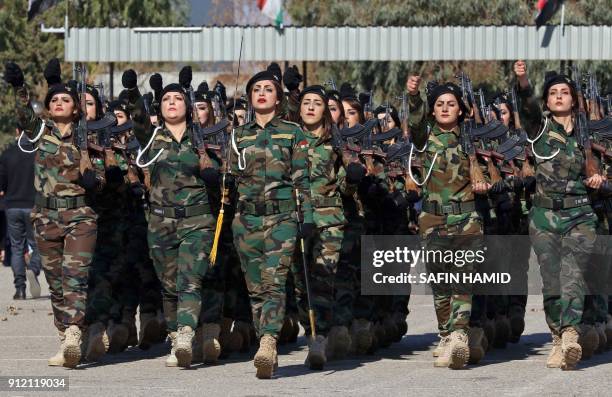 Iraqi Kurdish Peshmerga take part in a graduation ceremony at the Zakho military academy in the Iraqi Kurdish town of Zakho, some 500 kilometres...
