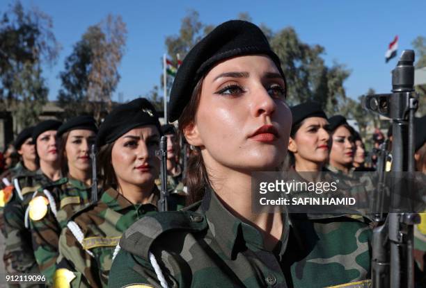 Iraqi Kurdish Peshmerga take part in a graduation ceremony at the Zakho military academy in the Iraqi Kurdish town of Zakho, some 500 kilometres...
