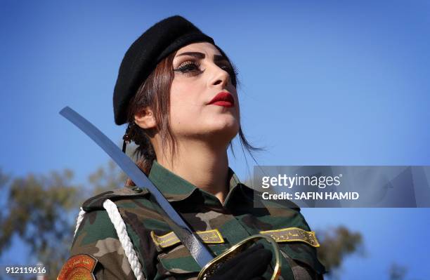 An Iraqi Kurdish Peshmerga takes part in a graduation ceremony at the Zakho military academy in the Iraqi Kurdish town of Zakho, some 500 kilometres...