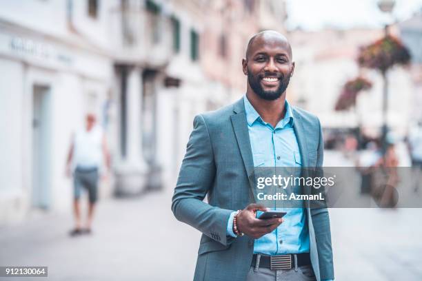 portrait of businessman in the city - facing camera professional outdoor stock pictures, royalty-free photos & images