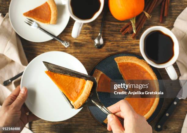 pumpkin pie, traditional pie for thanksgiving day - man eating pie stock-fotos und bilder