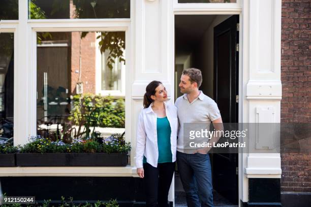 lovely couple in their new house in amsterdam - nederland stock pictures, royalty-free photos & images