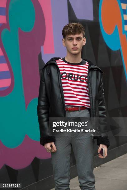 Fashion blogger and model Nikolas Santur wears a Zara jacket, Asos Trousers and a Fiorucci t shirt day 3 of London Mens Fashion Week Autumn/Winter...