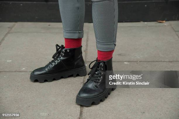 Fashion blogger and model Nikolas Santur wears Asos Trousers, Underground shoes day 3 of London Mens Fashion Week Autumn/Winter 2018, on January 08,...