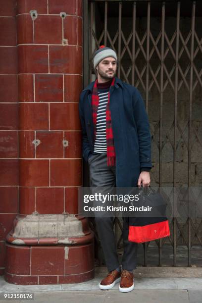 Presenter and Actor Stephen Kelly wears Grenson shoes, vintage trousers, Steig Lorgan bag, Norse Projects sweater, YMC jacket and hat and a Lochmeir...