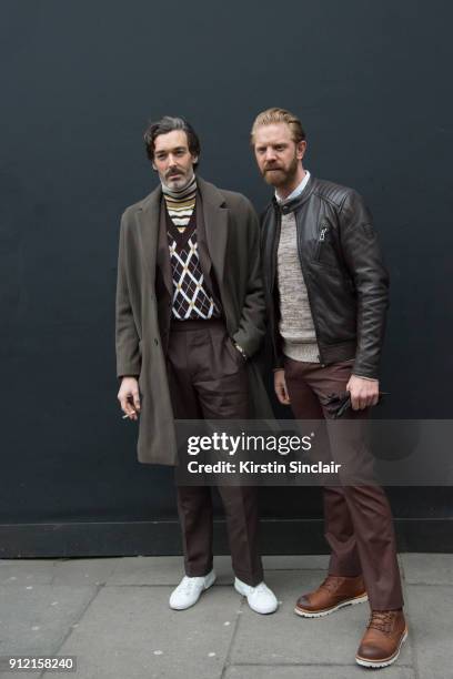 Model Richard Biedul wears a Reiss coat, Daks London sleeveless sweater and roll neck sweater, Chester Barrie brown suit with Photographer Alistair...