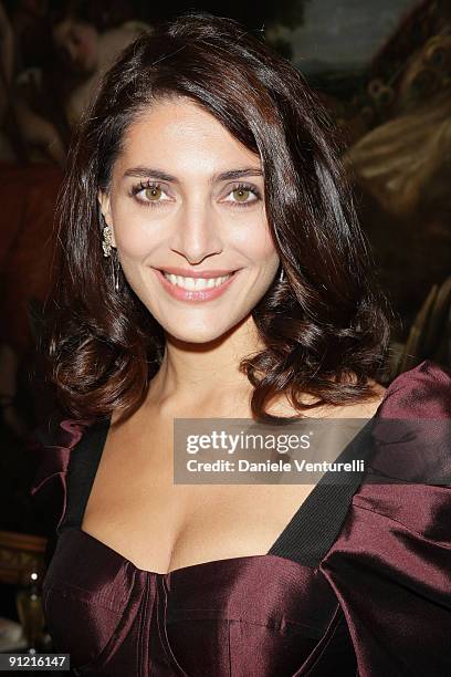 Caterina Murino attends the Dolce & Gabbana show as part of Milan Womenswear Fashion Week Spring/Summer 2010 on September 27, 2009 in Milan, Italy.