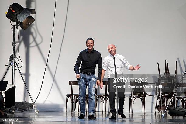 Italian designers Stefano Gabbana and Domenico Dolce acknowledge the applause of the public after the Dolce & Gabbana show as part of Milan...