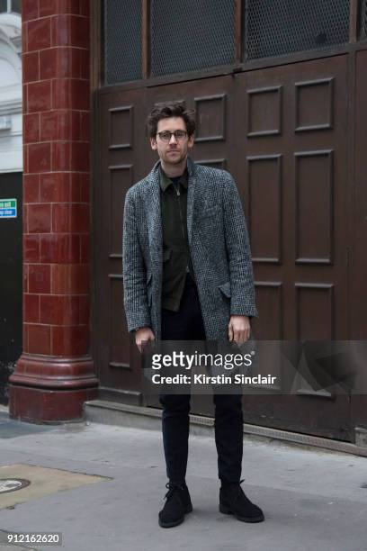 Style Director at Esquire magazine Charlie Teasdale wears a Brunello Cucinelli coat, Kent and Curwen jacket, Grenson shoes, Oliver Peoples glasses...