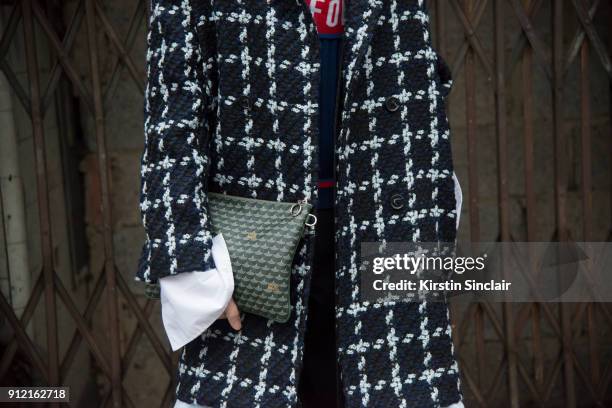 Fashion buyer for Lane Crawford Adrian Yu wears a Demo jacket and a Faine Le Page bag day 3 of London Mens Fashion Week Autumn/Winter 2018, on...