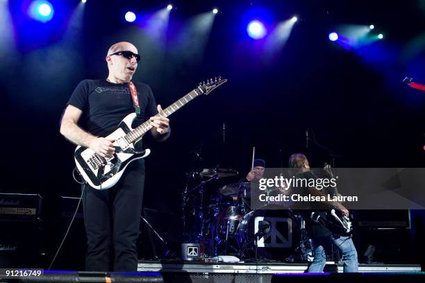 Guitarist Joe Satriani, drummer Chad Smith and bassist Michael Anthony of Chickenfoot perform at the Gibson Amphitheatre on September 27, 2009 in...