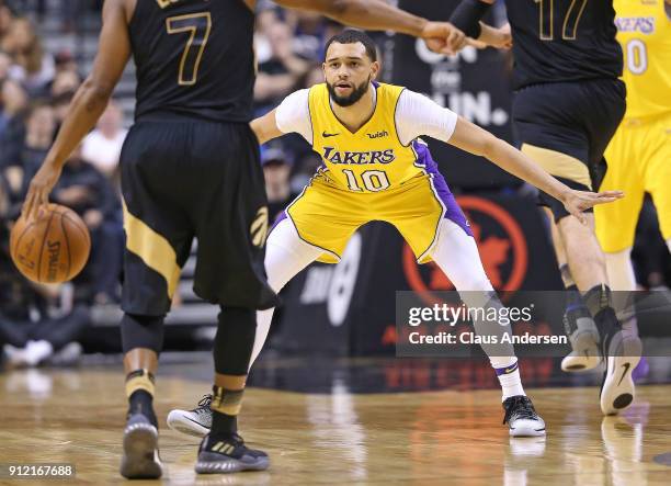 Tyler Ennis of the Los Angeles Lakers defends against the Toronto Raptors in an NBA game at the Air Canada Centre on January 28, 2018 in Toronto,...