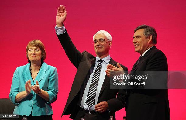 Chancellor of the Exchequer Alistair Darling , surrounded by Prime Minister Gordon Brown and Deputy Leader of the Labour Party Harriet Harman, waves...