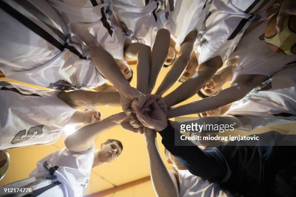 basketball team stacking - professional sportsperson stock pictures, royalty-free photos & images