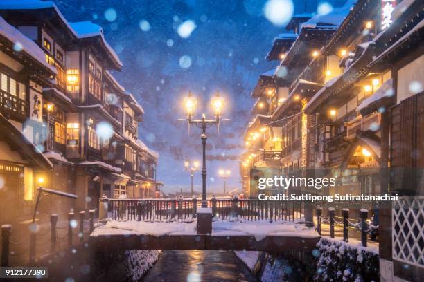 heavy snow blizzard in obanazawa ginzan onsen, japan hot springs town. - yamagata stock-fotos und bilder