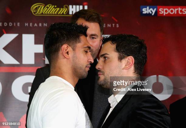 Amir Khan and Phil Lo Greco square up during an Amir Khan and Phil Lo Greco press conference at the Hilton Hotel on January 30, 2018 in Liverpool,...