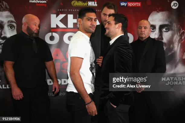 Amir Khan and Phil Lo Greco square up during an Amir Khan and Phil Lo Greco press conference at the Hilton Hotel on January 30, 2018 in Liverpool,...