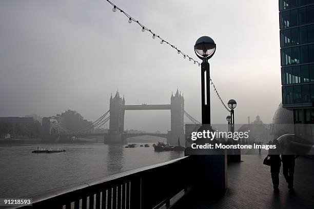 tower bridge in london, england - fog london stock pictures, royalty-free photos & images