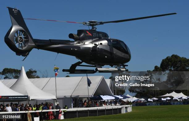 Usain Bolt arrives in a helicopter during the 2018 Sun Met at Kenilworth Racecourse on January 27, 2018 in Cape Town, South Africa. The 134th edition...