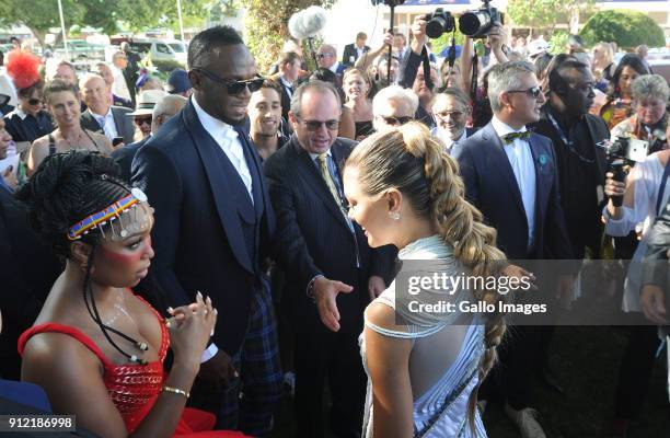 Miss Universe, Demi-Leigh Nel-Peters and Usain Bolt during the 2018 Sun Met at Kenilworth Racecourse on January 27, 2018 in Cape Town, South Africa....