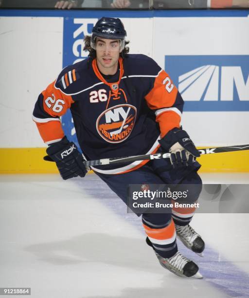 Matt Moulson of the New York Islanders skates against the New Jersey Devils during preseason action at the Nassau Veterans Memorial Coliseum on...